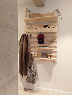 a coat rack made out of wooden pallets