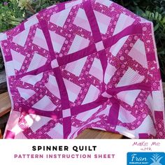 a pink and white quilt with the words spinner quilt pattern instruction sheet on it