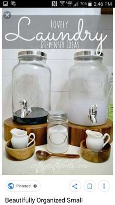 there are two glass jars with lids and spoons next to each other