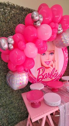 a barbie birthday party with balloons and decorations