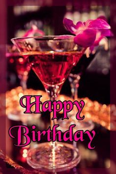 a happy birthday card with two martinis and pink flowers on the table next to each other