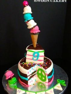 a birthday cake with an ice cream cone on top