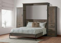 a bed sitting in a bedroom next to a tall wooden dresser with drawers on each side