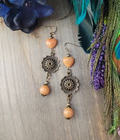 These gorgeous rustic tan agate and aventurine stone boho style earrings with antiqued bronze mandala charm are a perfect addition to your Bohemian style wardrobe!  You will love wearing these unique earrings with any outfit whether casual or dressy. All of my jewelry creations come in a beautiful satin drawstring bag perfect for gift giving. E210 Bronze Accessories, Mandala Earrings, Boho Style Earrings, Aventurine Stone, Floral Mandala, Earrings Heart, Bronze Jewelry, Earrings Bohemian, Long Dangle Earrings