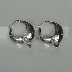 A PAIR of chunky ethnic style sterling silver hoops. Dimensions: 32 x 35 x 10 mm. Weight: 2.9gm These earrings are made of 925 hypoallergenic sterling silver. All my pieces are sent in a gift box. I can include a personal message from you if needed. You are welcome to contact me at... bhavnakwintra1956@gmail.com More hoops: https://www.etsy.com/your/shops/TheSilverGame/tools/listings/section:26305414 More earrings: https://www.etsy.com/your/shops/TheSilverGame/tools/listings/section:26308789 Ear Silver Metal Hoop Huggie Earrings, Silver Hoop Earrings For Pierced Ears, Silver Small Hoop Earrings For Pierced Ears, Hoop Earrings Chunky, Hoops Silver, Egyptian Style, Hoop Charms, Ethnic Style, Sterling Silver Hoops