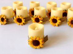 sunflower candles are arranged in the shape of a heart