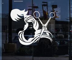 a woman's face with scissors in front of a shop window that says hair stylist