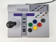 an old computer game controller with buttons and knobs