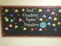 a sign that says 2nd grader's space invaders on the side of a wall