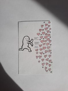 a piece of paper with hearts on it and a sticker in the shape of a dog