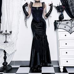 Explore luxury with our Dark Gothic Rose Lace Velvet Maxi Skirt. This elegant skirt showcases a unique design with ruffles, lace embroidery, and velvet rose details, radiating sophistication and exclusivity. The all-in-one design adds a distinctive flair to the pleated and layered mermaid style in black velvet, perfect for those seeking a touch of opulence in their wardrobe. Ruffles Lace embroidery Velvet rose details Pleated and layered mermaid style Black velvet fabric All-in-one design Fitted Black Skirt For Halloween, Halloween Evening Fitted Skirt, Fitted Skirt For Halloween Evening, Fitted Evening Skirt For Halloween, Fitted Black Bottoms With Mermaid Hem, Fitted Black Mermaid Hem Bottoms, Black Mermaid Hem Bottoms, Fitted Bottoms With Mermaid Hem For Evening, Fitted Mermaid Hem Bottoms For Evening