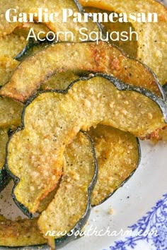 garlic parmesan acorn squash on a blue and white plate with text overlay