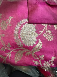 This stunning pink 100% Mulberry Katan silk saree is handwoven in Banaras, known for its intricate designs and high-quality craftsmanship. The saree features a beautiful shade of dual pink with gold and silver zari jaal work creating a mesmerizing effect. Loolong for a distinct saree - this is the one with silver zari outlining . The saree is perfect for any special occasion, such as a wedding, festival, or formal event. Comes finished with hand fall and Pico. And a blouse piece with zari border. Silk Mark Certified Note: Colors that show up on your screen may vary slightly from the actual product due to variations in settings. Also, the actual product may appear to be different hues depending on the ambience lighting.Note: There may be very slight inconsistencies such as in the weave/moti Luxury Pink Katan Silk Blouse Piece, Ambience Lighting, Katan Silk Saree, Katan Silk, Intricate Designs, Blouse Dress, Blouse Piece, Saree Blouse, Top Dress