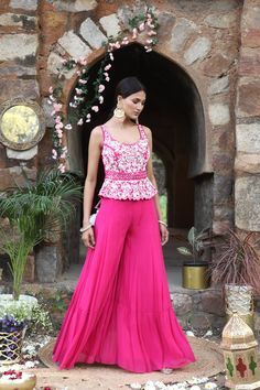 Featuring here fuscia peplum with swquence , bead, zari work paired with sharara set. Fabric - Silk, Georgette Components - 2 Colour - Fuscia Embroidery details - hand and Machine Embroidery Delivery time - 2-3 weeks Washing Instructions - Dry-clean Festive Peplum Sets For Reception, Peplum Lehenga With Zari Work, Peplum Sharara With Resham Embroidery, Semi-stitched Peplum Party Sets, Semi-stitched Peplum Sets For Party, Festive Embellished Peplum Lehenga, Anarkali Embellished Peplum Sets, Anarkali Sets With Embellished Peplum, Embellished Georgette Peplum Sharara