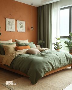 a bed with green sheets and pillows in a bedroom next to a large window that has plants on it