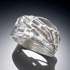 Silver Ring - Sterling silver strands are intertwined to create this openwork ring. The edge is slightly freeform and the design is low in profile. Quarter sizes 47. Silver Strand, Artful Home, The Edge, Tangled, Twine, Precious Metals, Silver Ring, Sterling Silver Rings, Original Art