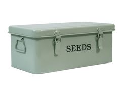 a white box with the words seeds written on it and two metal latches at the top