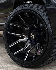 the rims and tires of a black car