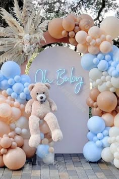 balloons and teddy bears are arranged in the shape of an arch for a baby shower