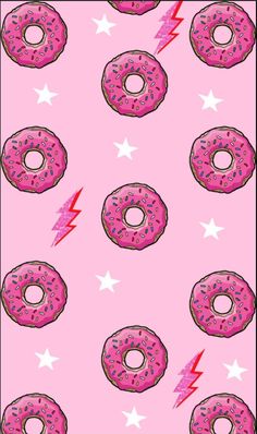 pink donuts with sprinkles and lightning bolts on a pink background