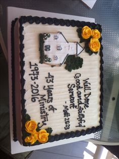 a sheet cake with flowers on it sitting on a table