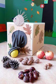 an assortment of fruits and nuts on a table with a box in the background that says autumn