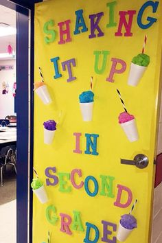 a classroom door decorated with ice cream and cupcakes that say shaking it up in second grade