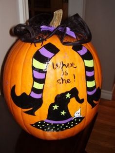 a carved pumpkin with a witch's hat on it that says, where is she?