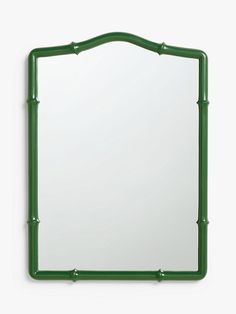 a green mirror hanging on the wall