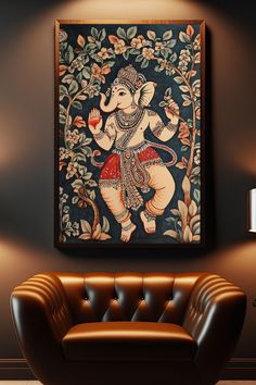 an elephant painting hanging on the wall above a brown leather chair in a living room