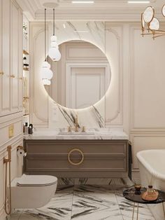 a bathroom with marble flooring and white walls, an oval mirror above the sink