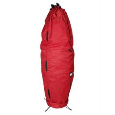 a red garment bag sitting on top of a white floor next to a black pole