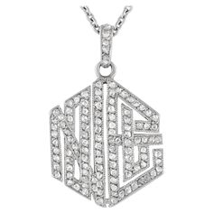 This vintage Cartier necklace exudes old fashioned elegance. Ideal for any occasion, this timeless accessory features a hexagonal pendant measuring 1.15 long by 0.75 wide suspended from a sleek 18 chain. Crafted from platinum, sparkling inset diamonds allow it to effortlessly catch the light.This jewelry piece is offered in estate condition and includes a gift pouch. Cartier Pendant, Vintage Cartier Watch, Cartier Vintage, Cartier Diamond, Cartier Necklace, Vintage Pendant Necklace, Key Pendant Necklace, Pendant Diamond, Solitaire Pendant Necklace