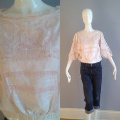 Beautiful Victorian Inspired Blouse by French Designer René Dehry Made From 100% Light Weight Cotton in Blush Pink Delicate Lace And Embroidery Details Throughout Dolman Sleeves Blouse Buttons Up Back 100% Cotton, Made In India Excellent Vintage Condition Tag Reads Size Medium With Top Lying Flat in Inches: Shoulders: 16 Underarms: 20 Waist: 15 Inseam of arm:  12 Total Length: 20 Victorian Top, Bohemian Shirt, Edwardian Blouse, Pink Bohemian, Statement Jacket, Sleeves Blouse, French Designer, Embroidery Details, French Design