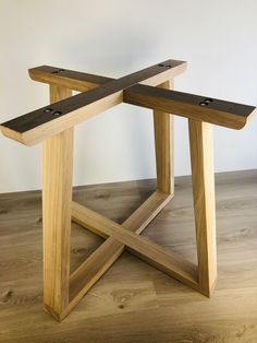 two wooden benches sitting on top of a hard wood floor