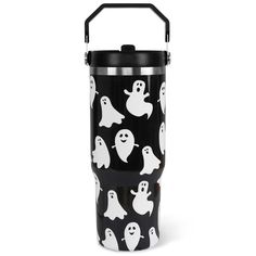 a black and white cup with ghost faces on it