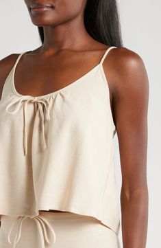 A cover-up duo delivers a tank top and flowy skirt that work for any summery day or activity. Top had scoop neck; skirt has drawstring waist 19" top length; 37" skirt length (size Medium) Unlined 85% viscose, 15% linen Machine wash, line dry Imported Sleeveless Top With Drawstring Tie For Vacation, Drawstring Tank Top For Beach In Spring, Summer Drawstring Tops For Loungewear, Summer Beach Top With Drawstring, Vacation Sleeveless Top With Drawstring, Sleeveless Vacation Tops With Drawstring, Summer Beachwear Tops With Drawstring, Summer Vacation Tops With Tie Waist, Summer Beach Tops With Drawstring