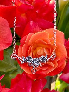 "This romantic Rose Tendril Pendant is adorned with three sculptural roses and cast in sterling silver. Curvacious vine tentriles extend at both sides and flow down from the center of the pendant. You may choose from two styles of sterling silver chains. A 16\" twisted figure eight chain is attached to the side tendrils. Gift yourself or someone special this bouquet of roses. This piece is 2 1/4\" across and 7/8\" high.  This item usually ships the same or next business day. All Marty Magic Jewe Sterling Roses, Brown Leather Necklace, Silver Flower Necklace, Pretty Jewelry Necklaces, Silver Chains, Rose Necklace, Rose Jewelry, Jewelry Statement, Valentines Day Gifts For Her