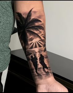 a person with a tattoo on their arm holding onto a palm tree and two people