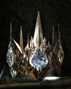 a crystal crown sitting on top of a table