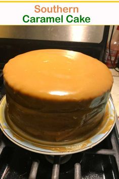 a cake sitting on top of a stove with caramel frosting in the middle