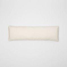 a white pillow on a white background