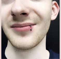 a man with a piercing on his nose