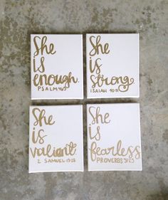 four white and gold coasters with the words she is enough