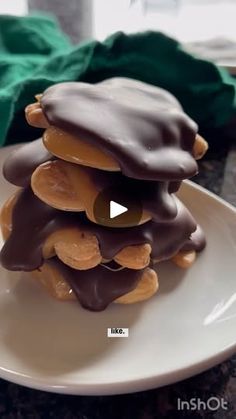 a white plate topped with chocolate covered cookies