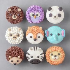 the cupcakes are shaped like animals and have different designs on each one side