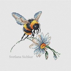 a cross stitch pattern with a bee and daisies