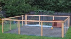 a chicken coop in the middle of a yard