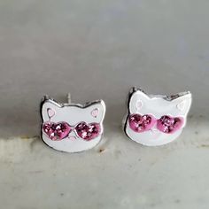 925 Sterling Silver Tiny Cat Stud Earrings Metal:925 Sterling Silver Hallmark:925 Width:8 mm Height:8 mm >Nickel Free >No Allergic reaction >30 days return policy ++Items come in a gift box ready to be gifted Please contact me if you have any questions about the jewelry you are interested in buying. My Shop: https://www.etsy.com/shop/banujewelryusa Follow BANU Jewelry on Facebook, Instagram and other social media sites to keep up to date with newest products. www.instagram.com/shopbanuj Silver Cat Ears Jewelry, Pink Cat Ears Jewelry As Gift, Pink Cat Ears Jewelry As A Gift, Adjustable Cat Ears Earrings For Gift, Adjustable Cat Ears Earrings As Gift, Cat Design Earrings With Cat Ears Shape For Gift, Cat Design Earrings With Cat Ears For Gifts, Cute Cat Ears Jewelry For Pierced Ears, Cat Design Earrings With Cat Ears