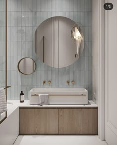 a bathroom with a sink, mirror and towel rack